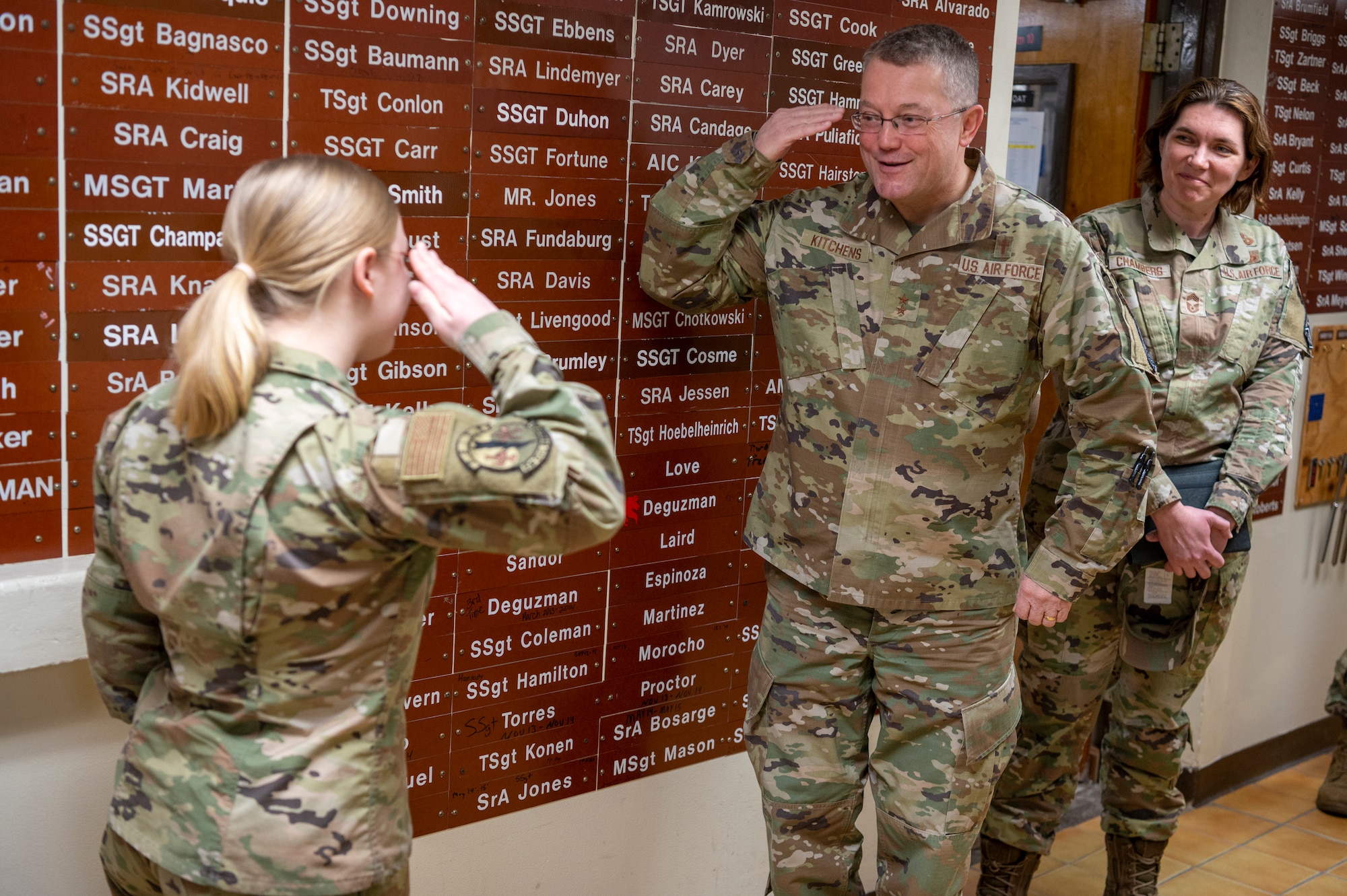 U.S. Air Force Maj. Gen. Randall Kitchens, U.S. Air Force Chief of Chaplains, salutes Senior Airman Julia Morgan, 51st Civil Engineer Squadron lock shop technician at Osan Air Base, Republic of Korea, Feb. 21, 2023. Morgan was coined for her exemplary performance as an Airman and a locksmith. Morgan is one of two General Services Administration-certified locksmiths on the Korean Peninsula. (U.S. Air Force photo by Airman 1st Class Aaron Edwards)