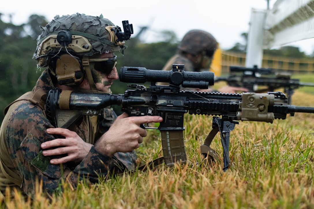 U.S. Marines with 3d Battalion, 4th Marines provide security at a helicopter landing zone during Jungle Warfare Exercise 23 in the Northern Training Area on Okinawa, Japan, Feb. 14, 2023. JWX 23 is a large-scale field training exercise focused on leveraging the integrated capabilities of joint and allied partners to strengthen all-domain awareness, maneuver, and fires across a distributed maritime environment. (U.S. Marine Corps photo by Cpl. Alyssa Chuluda)