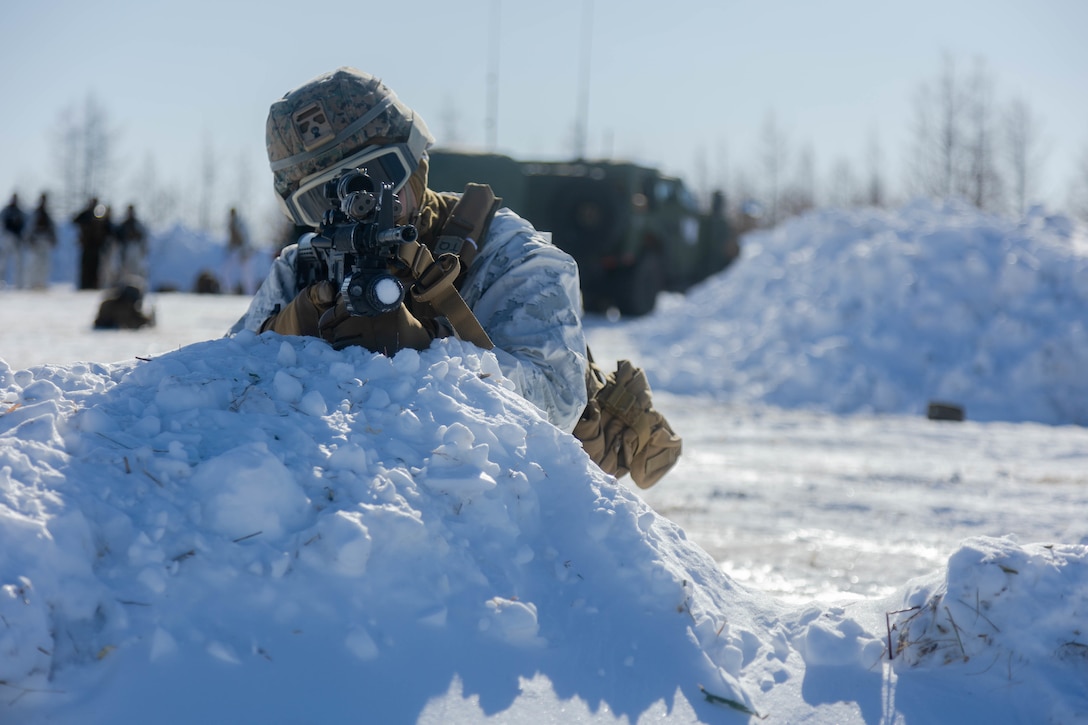 U.S. Marine Corps Lance Cpl. Brandon Nava, a supply administration and operations specialist with 3d Battalion, 12th Marines, posts security during Artillery Relocation Training Program 22.4 at the Yausubetsu Training Area, Hokkaido, Japan, Jan. 27, 2023. The skills developed at ARTP increase the proficiency and readiness of the only permanently forward-deployed artillery unit in the Marine Corps, enabling them to provide precision indirect fires. Nava is a native of El Paso, Texas. (U.S. Marine Corps photo by Lance Cpl. Jaylen Davis.)