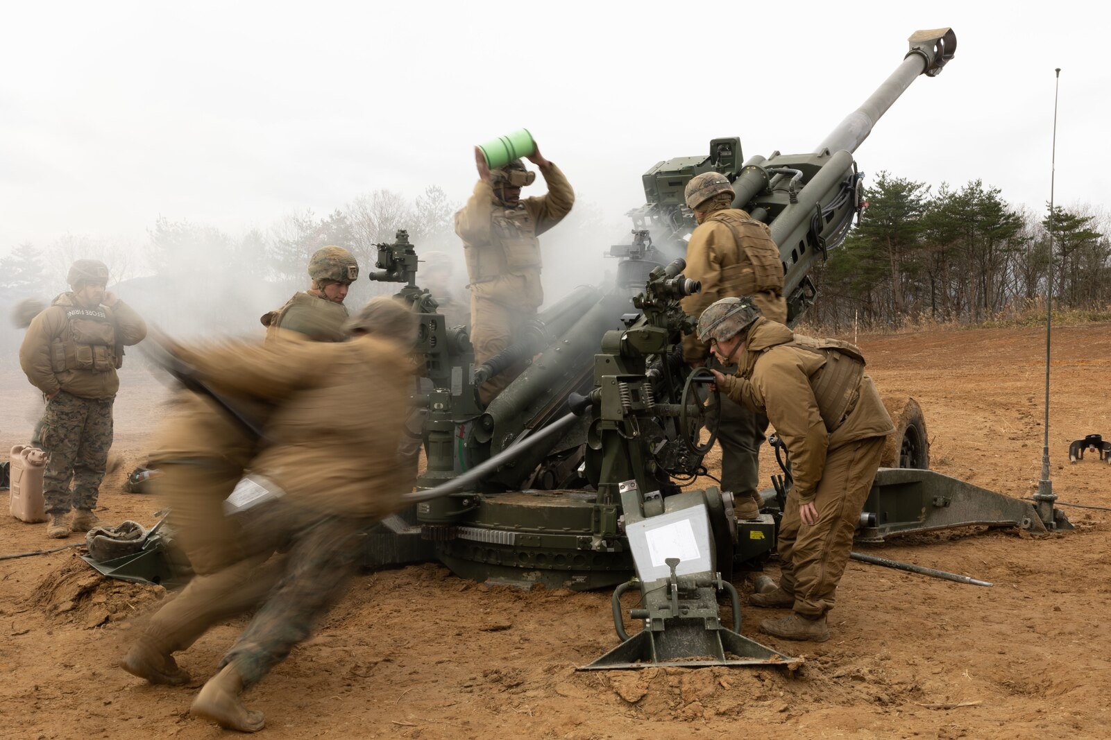U.S. Marines with 3d Battalion, 12th Marines conduct live fire training during Artillery Relocation Training Program 22.3 at Ojojihara Maneuver Area, Japan, Dec. 1, 2022. The skills developed at ARTP increase the proficiency and readiness of the only permanently forward-deployed artillery unit in the Marine Corps, enabling them to provide precision indirect fires. (U.S. Marine Corps photo by Lance Cpl Eduardo Delatorre)