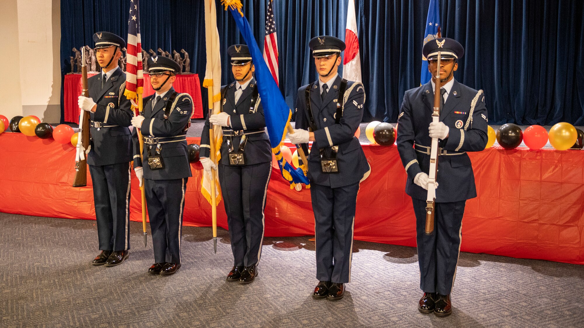 Members of the Yokota Air Base Honor Guard post the colors to begin the 2023 Annual Awards Ceremony at Yokota Air Base, Japan, Feb. 24, 2023.