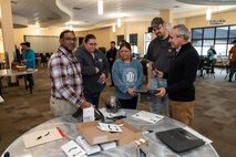 Photo of depot employees examining new equipment during the NET Day educational event.