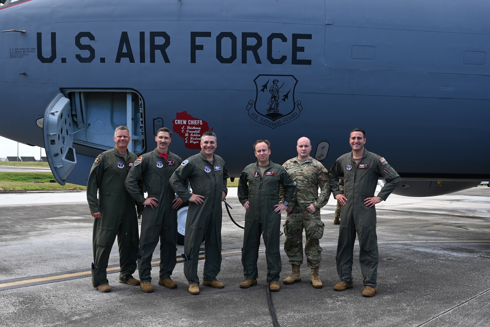 Maj. Gen. Paul Knapp, third from left, Wisconsin’s adjutant general, and Capt. Mark Gerasimov, Knapp’s aide de camp, second from right, with deployed members of the Wisconsin Air National Guard’s 128th Air Refueling Wing at Andersen Air Force Base in Guam Feb. 3, 2023. The deployed Airmen are supporting the 506th Expeditionary Air Refueling Group, which provides the aerial refueling and airlift capabilities that support critical U.S. Indo-Pacific Command missions.