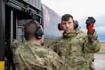 U.S. Air Force Tech. Sgt. Matthew Willard, right, with the 157 Logistics Readiness Squadron, Pease Air National Guard Base, New Hampshire, is instructed how to perform a hot-pit refuel of an F-16C+ Fighting Falcon by Tech. Sgt. Charles A. Zingrone Jr., 177th Logistics Readiness Squadron Fuels Management Flight fuels information service center section chief, during Integrated Combat Turnaround training Feb. 17, 2023, at the 177th Fighter Wing, Egg Harbor Township, New Jersey.