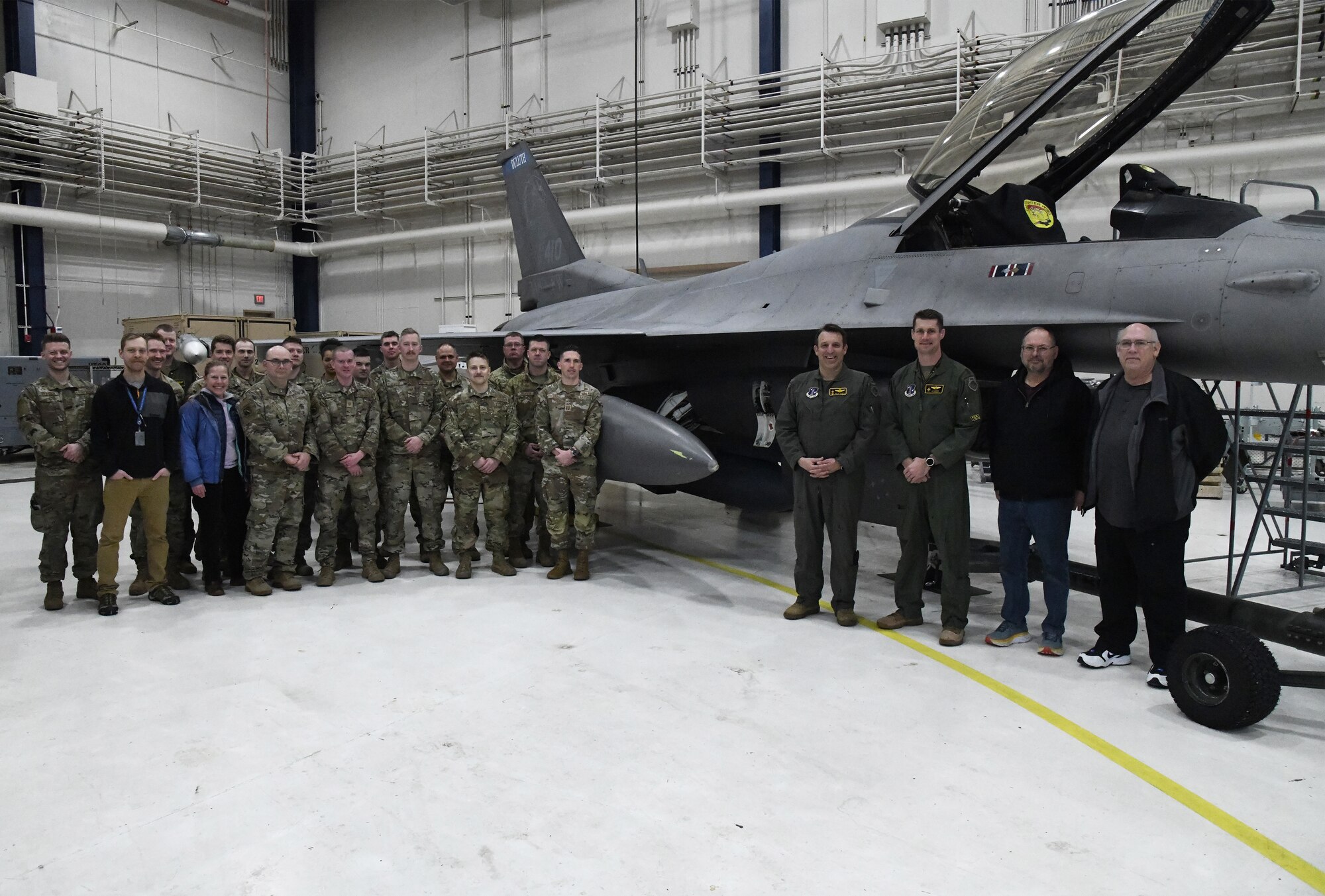 Subject matter experts from Air Combat Command, Air Force Materiel Command, the Air National Guard, Air Force Life Cycle Management Center, Air Force Reserve Test Center (AATC) and 148th Fighter Wing pose for a photo after the first AN/ASQ-236 radar was installed on an Block 50 F-16 Fighting Falcon on January 25, 2023. The 148th Fighter Wing has been designated as the Air National Guard’s Center for Excellence for all F-16 fighter aircraft.