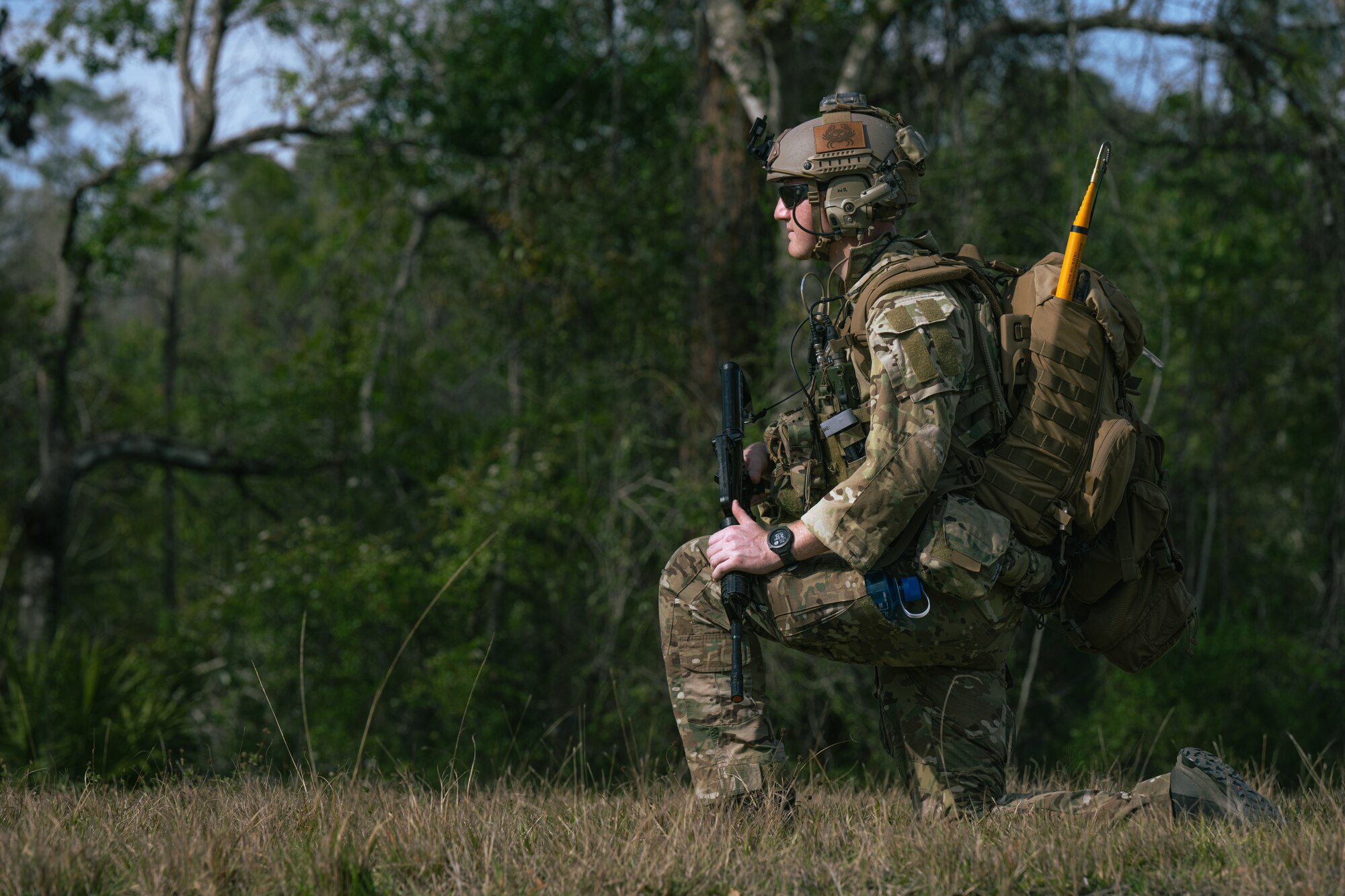 U.S. Air Force Airman 1st Class Walker Rowland, a 1st Special Operations Civil Engineer Squadron explosive ordnance disposal journeyman, stands watch during an exercise.
