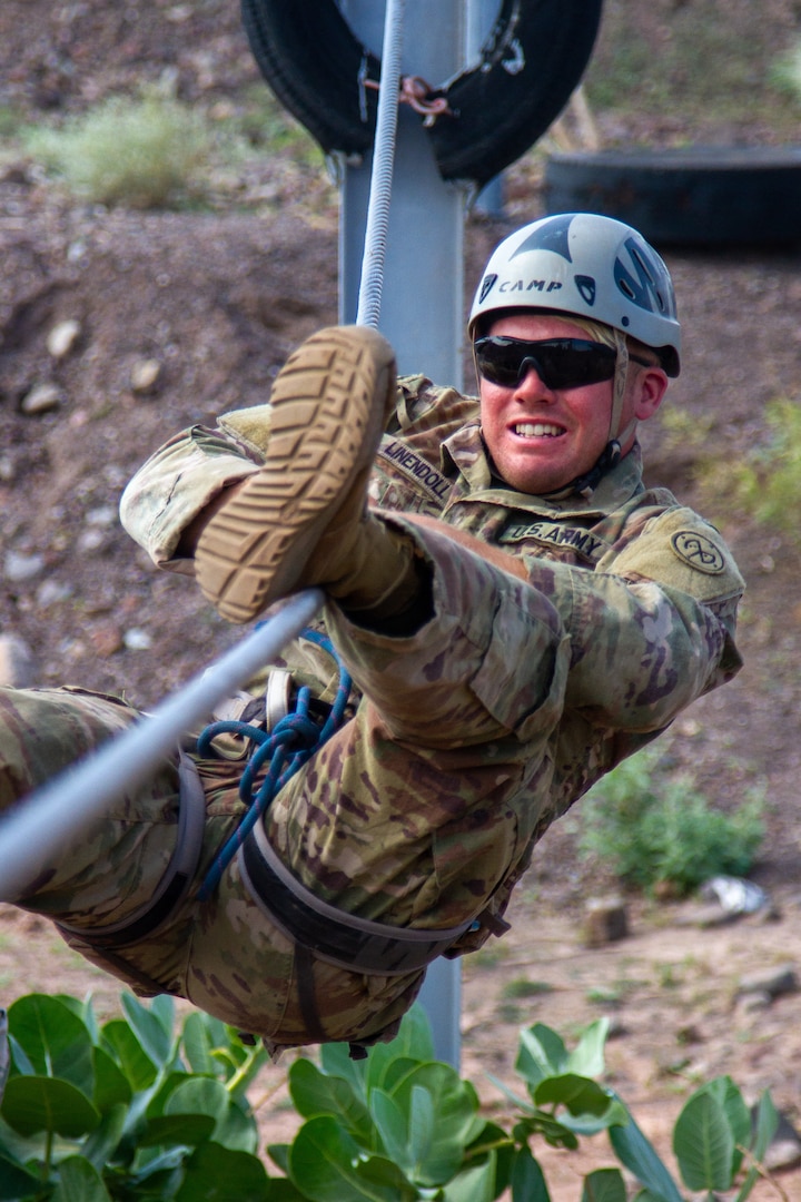 U.S. Army Spc. Barry Lindenoll, an infantryman assigned to Charlie Company, 2nd Battalion, 108th Infantry Regiment, traverses a cable during the French Desert Commando Course in Djibouti Jan. 29, 2023. Participants who successfully completed the training received the prestigious desert commando badge.