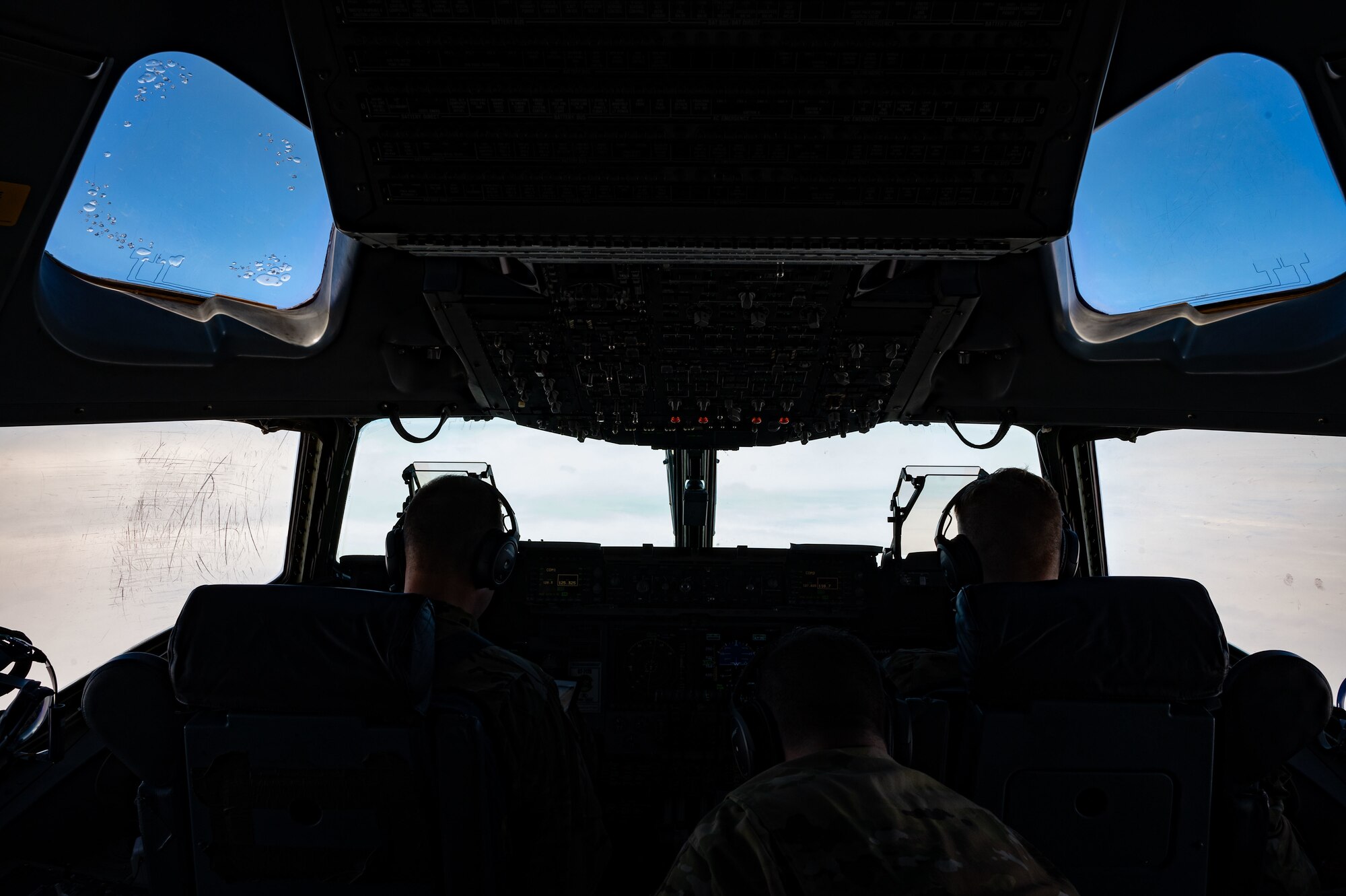 Aircrew from the 3rd Airlift Squadron monitor the skies over New York during a training mission aboard a C-17 Globemaster III, Feb. 21, 2023. The 3rd AS routinely flies local missions to exercise readiness. The squadron operates C-17s to provide global reach with unique, outsized and oversized airlift capability. (U.S. Air Force photo by Airman 1st Class Amanda Jett)