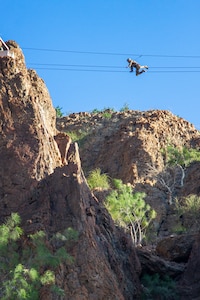 U.S. Army Spc. Rafael Ramos, a signal support system specialist assigned to Headquarters Company, 1st Battalion, 69th Infantry Regiment, traverses a rope bridge during the French Desert Commando Course in Djibouti Feb. 1, 2023.