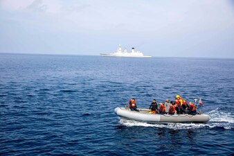 Sailors from USS Leyte Gulf (CG 55) return from training aboard the Italian navy destroyer ITS Caio Duilio (D 554).