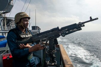 A Sailor stands watch as USS Paul Hamilton (DDG 60) transits the Strait of Hormuz.