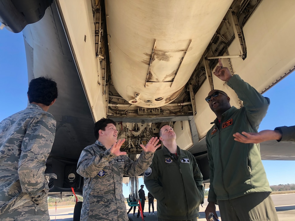 Airmen give a tour of a B-1 bomber.