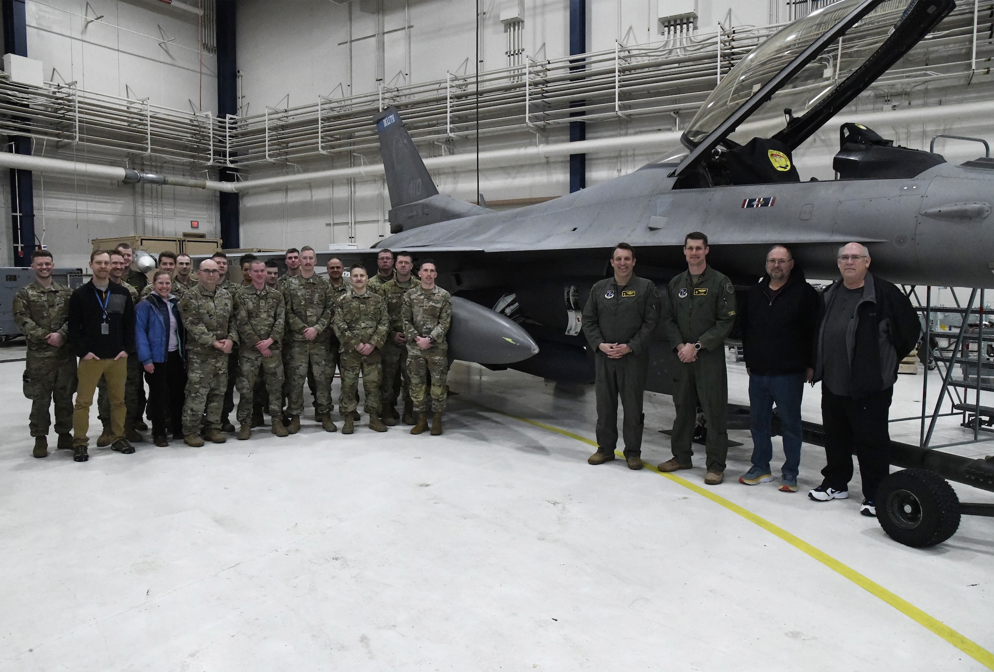 Subject matter experts from Air Combat Command, Air Force Materiel Command, the Air National Guard, Air Force Life Cycle Management Center, Air Force Reserve Test Center (AATC) and 148th Fighter Wing pose for a photo after the first AN/ASQ-236 radar was installed on an Block 50 F-16 Fighting Falcon on January 25, 2023. The 148th Fighter Wing has been designated as the Air National Guard’s Center for Excellence for all F-16 fighter aircraft.