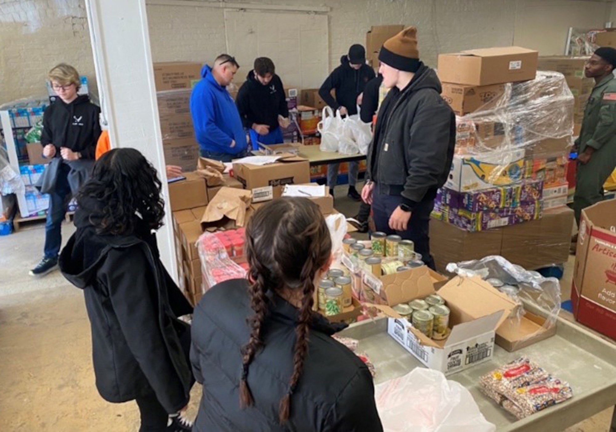 The 338th RCS G-Flight held an outstanding community event at the Love Chapel Food Bank, Columbus, IN. G Flight and their DEP aided the community and bagged over 400 bags of food for underprivileged children throughout Bartholomew County.