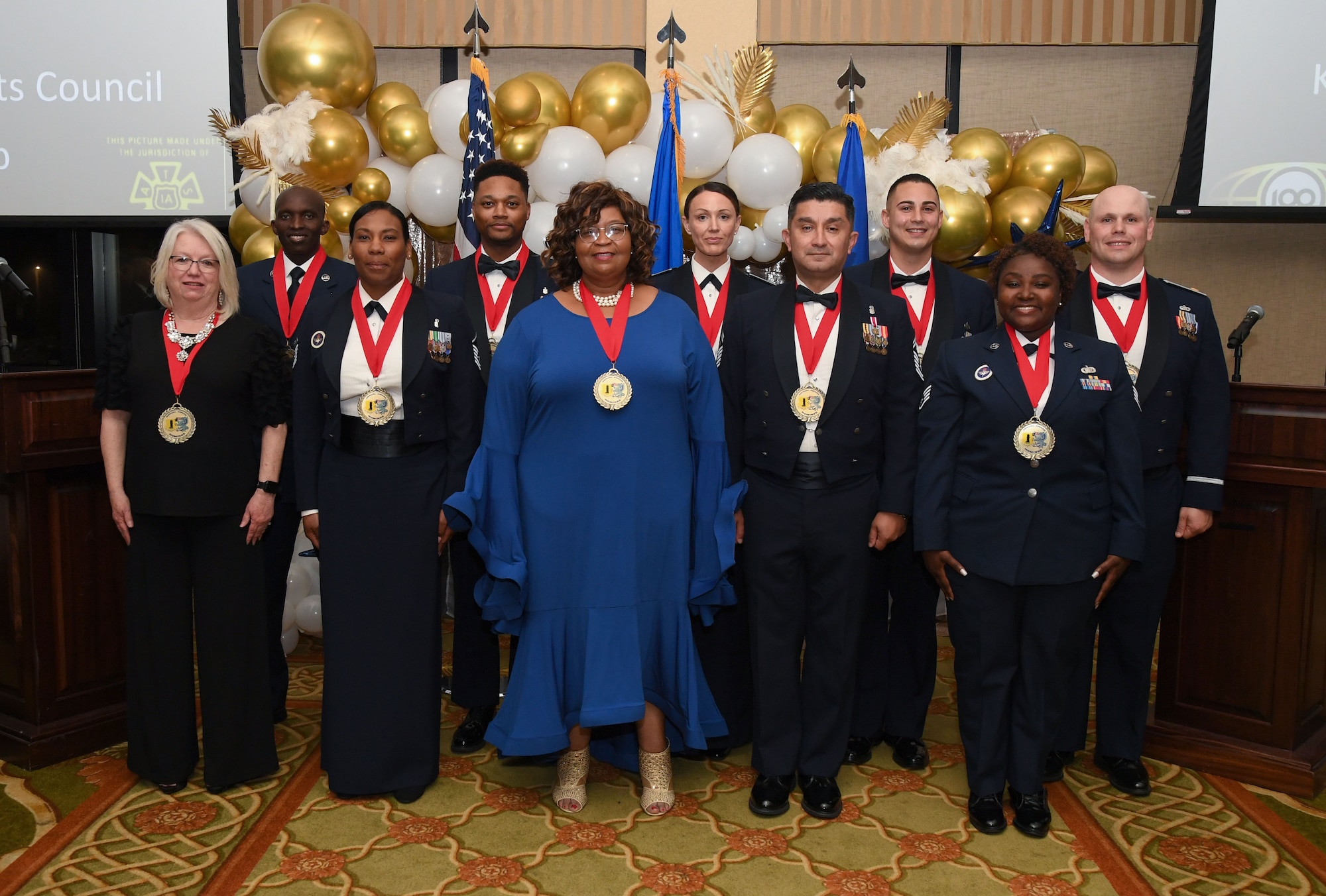 Winners of the 81st Training Wing's 2022 Annual Awards Ceremony pose for a photo inside the Bay Breeze Event Center at Keesler Air Force Base, Mississippi, Feb. 24, 2023.