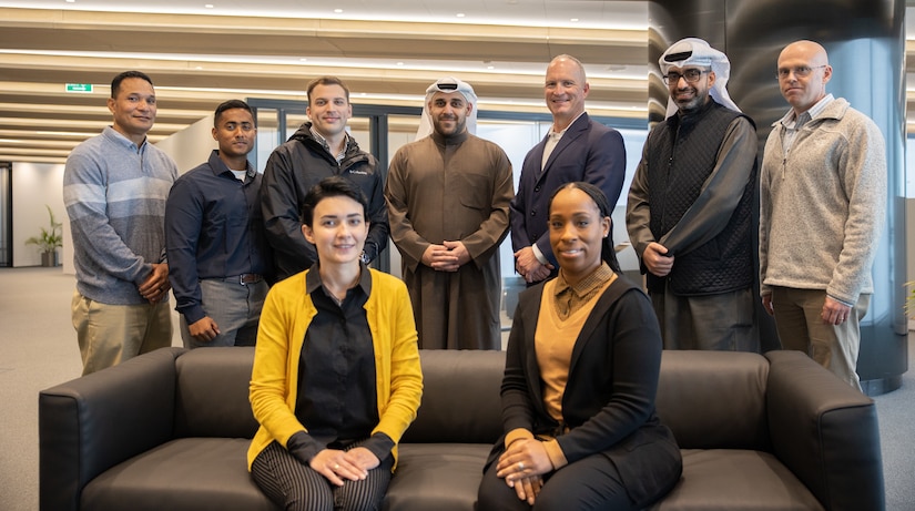 U.S. Army Soldiers with the 18th Financial Support Center join members of the National Bank of Kuwait in a group photo during a key leader engagement in Kuwait City, Kuwait, Jan. 25, 2023. The engagement concentrated on new capabilities to provide operational flexibility in funding the U.S. Central Command theater. (U.S. Army photo by Spc. Cecilia Soriano)