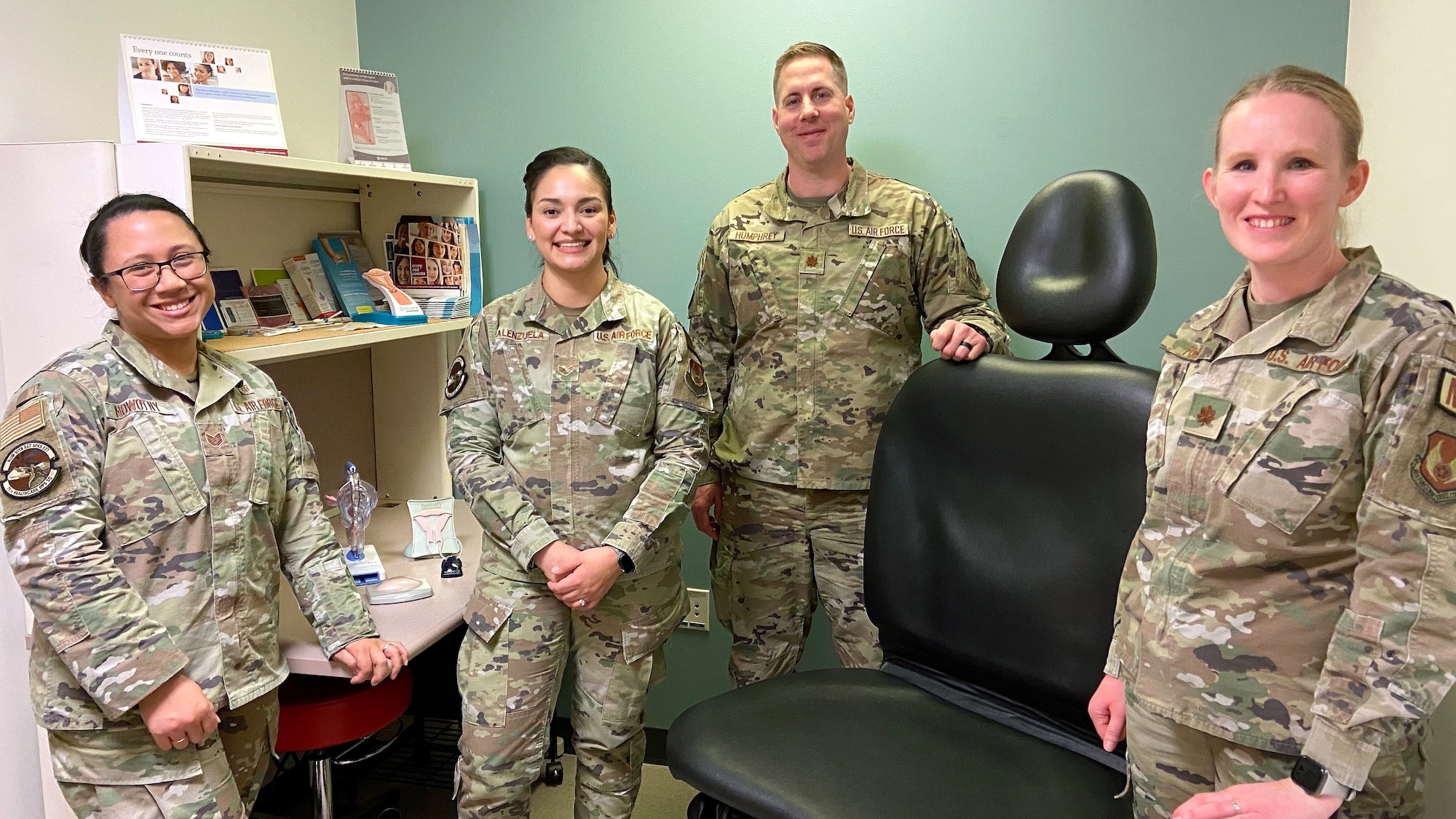 (Left to right) Tech. Sgt. Jessica Nowotny, Senior Airman Pollyann Valenzuela, Maj. Michael Humphrey, and Maj. Cassie Foss, 75th Medical Group, pose in one of the Women's Health Clinic exam rooms Feb. 23, 2023, at Hill Air Force Base, Utah. The clinic offers a walk-in contraception clinic every Tuesday from 8 a.m. to 10 a.m. (U.S. Air Force photo by Cynthia Griggs)