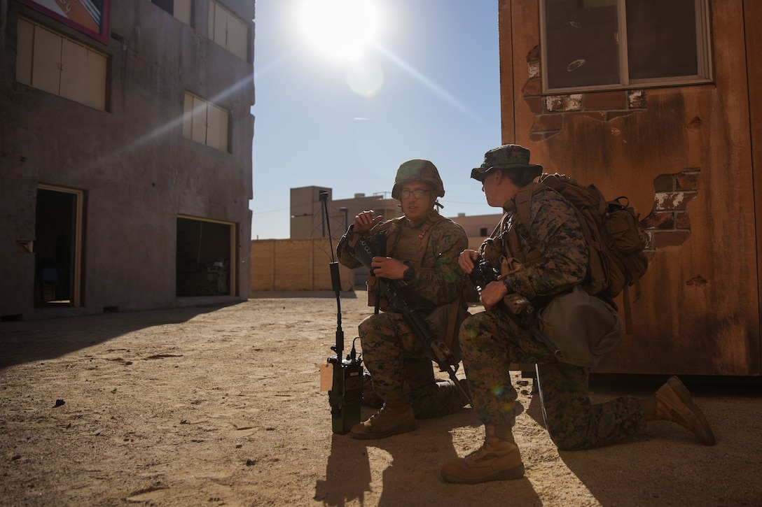 U.S. Marine Lance Cpl. Julian Morel, left, a transmissions system operator assigned to Combat Logistics Battalion 15, Combat Logistics Regiment 17, 1st Marine Logistics Group, briefs Lt. Col. Lindsay Mathwick, the commanding officer of CLB-15, during evacuation control center training as a part of CLB-15’s Marine Corps Combat Readiness Evaluation (MCCRE) at Marine Corps Base Camp Pendleton, California, Jan. 26, 2023. The purpose of CLB-15’s MCCRE is to evaluate the unit's ability to perform assigned mission essential tasks in preparation for a future deployment. (U.S. Marine Corps photo by Sgt. Sydney Smith)