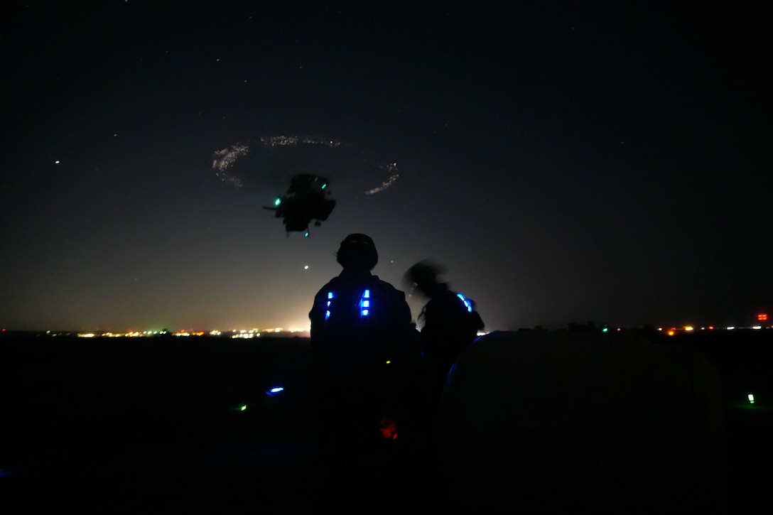 U.S. Marines assigned to Combat Logistics Battalion 15, Combat Logistics Regiment 17, 1st Marine Logistics Group, prepare to sling load equipment beneath a CH-53E Super Stallion attached to Marine Heavy Helicopter Squadron (HMH) 361, Marine Aircraft Group 16, 3rd Marine Aircraft Wing, during helicopter support team training as part of CLB-15’s Marine Corps Combat Readiness Evaluation (MCCRE) at Marine Corps Base Camp Pendleton, California, Jan. 25, 2023. The purpose of CLB-15’s MCCRE is to evaluate the unit's ability to perform assigned mission essential tasks in preparation for a future deployment. (U.S. Marine Corps photo by Sgt. Sydney Smith)