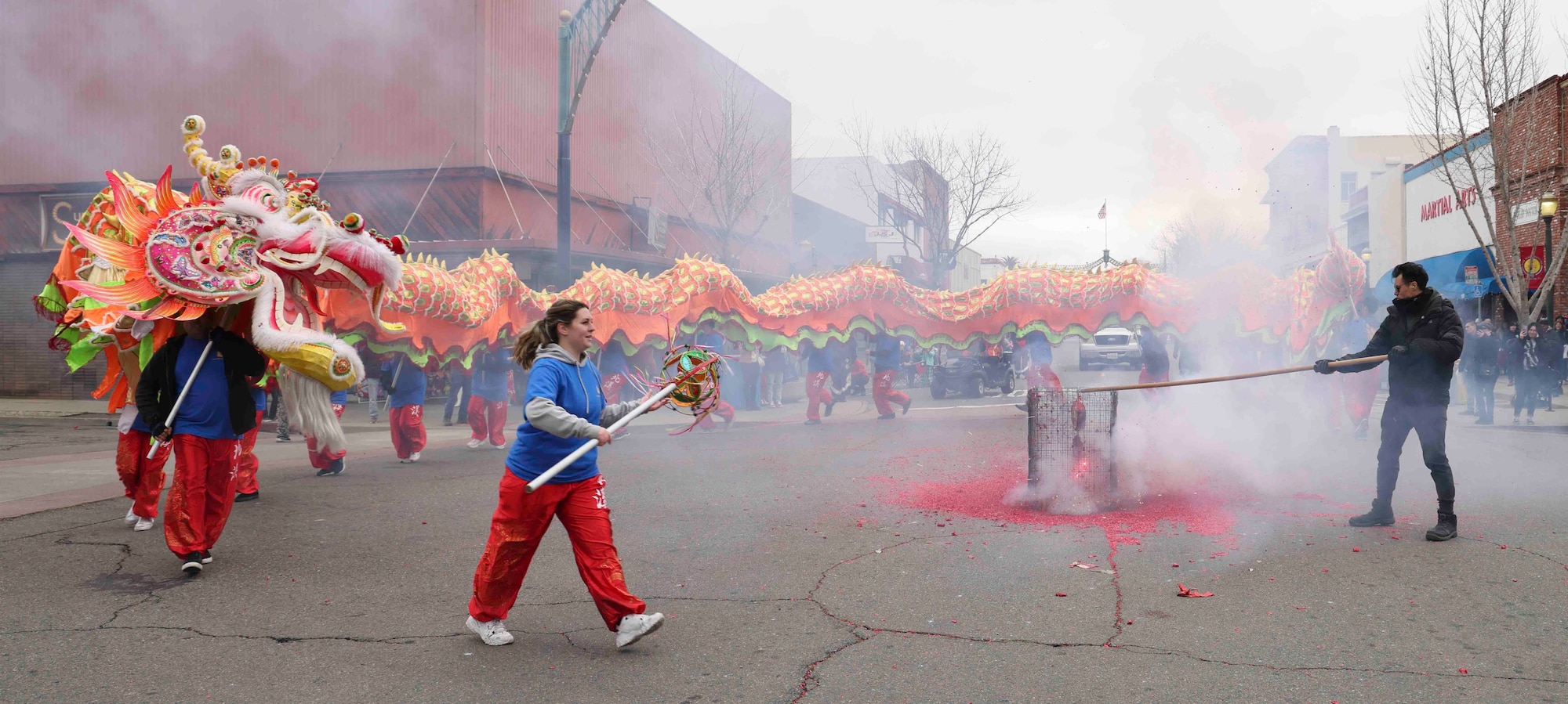 Airmen from Beale Air Force Base, Calif. carried the Chinese dragon while Senior Airman Zoey Martins, 9th Health Care Operations Squadron medical logistics technician, carried the “pearl” during the 143rd Bok Kai parade on Feb, 25, 2023, in Marysville, Calif.