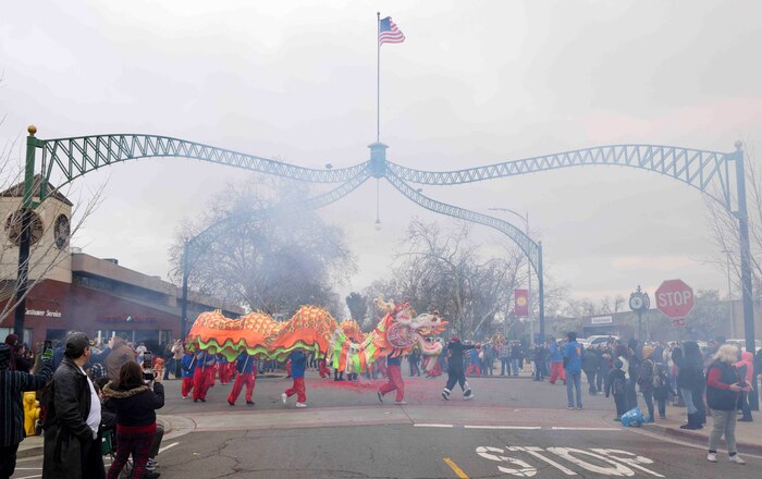 Airmen from Beale Air Force Base, Calif., volunteered to lift the dragon in the 143rd Bok Kai parade on Feb. 25, 2023 in Marysville, Calif.