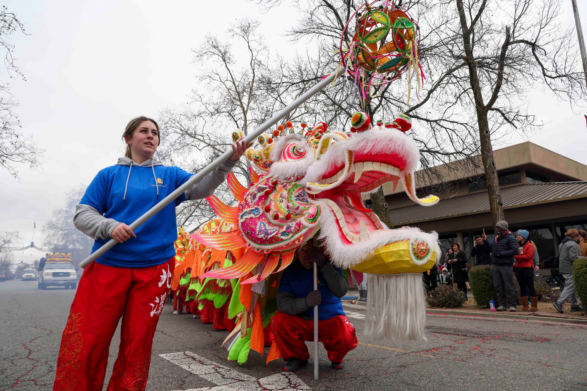 U.S. Air Force Senior Airman Zoey Martins, 9th Health Care Operations Squadron medical logistics technician, held the “pearl” for the Chinese dragon “Hong Wan Lung” carried by Airmen from Beale Air Force Base, Calif.  during the annual Bok Kai parade Feb, 25, 2023 in Marysville, Calif.