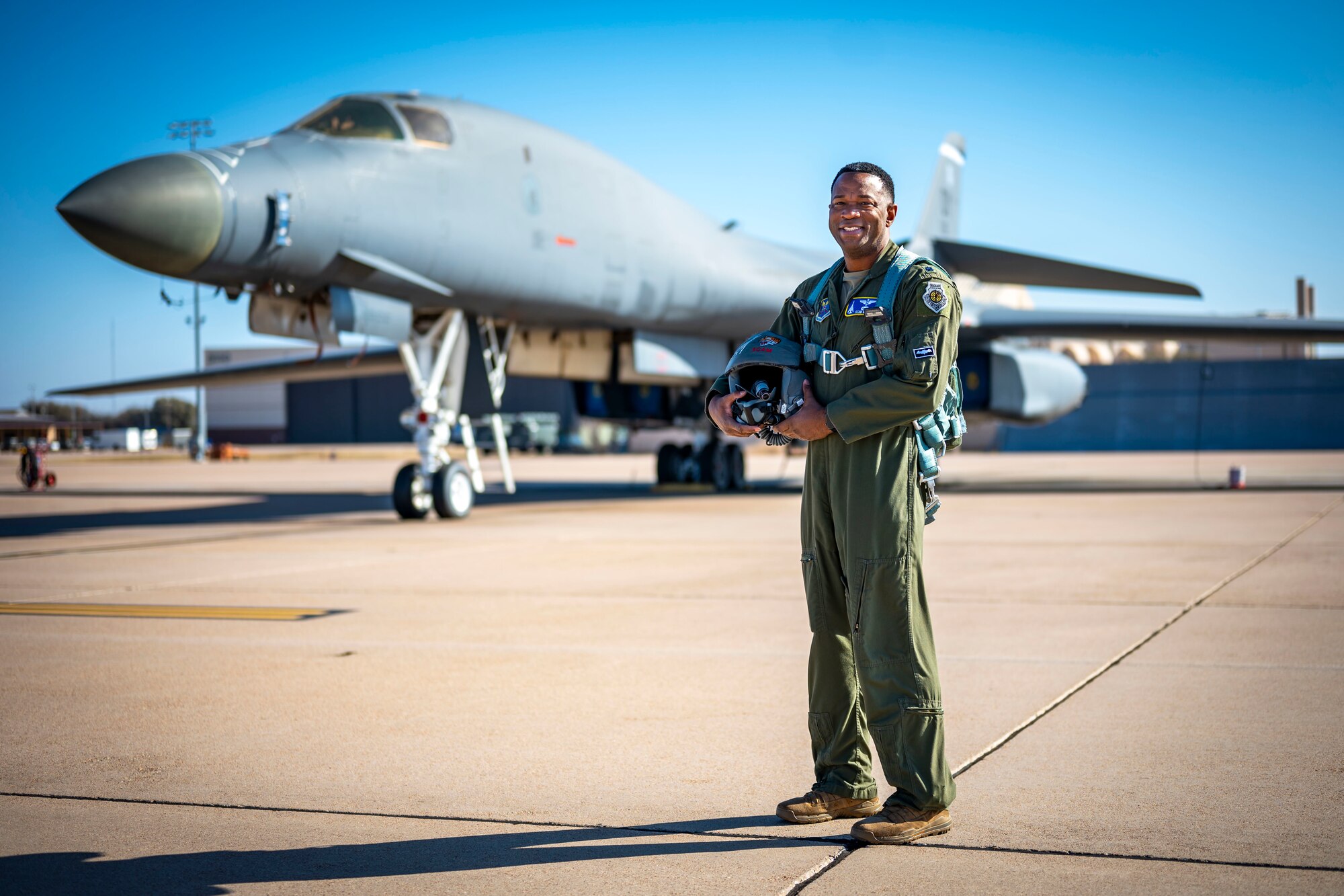 U.S. Air Force Lt. Col Brian Milner, 7th Bomb Wing director of staff, poses in front of a B-1B Lancer during Black History Month at Dyess Air Force Base, Texas, Feb. 15, 2023. Milner was born and raised on the Southside of Chicago. He started his Air Force journey in 2000, enlisting as an electronic warfare maintainer. He earned a Bachelor of Applied Science in Aeronautics from Embry Riddle and commissioned through Officer Training School in 2006. His diverse career has brought much mentorship to both officers and enlisted personnel while continuing forward. (U.S. Air Force photo by Senior Airman Leon Redfern)