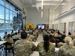 Dr. Chaunté Hall, chief executive officer of Centurion Military Alliance speaks to the Airmen of 616th Operations Center at the Tech Port in San Antonio. The professional development seminar was not only beneficial for the 150 Airmen in attendance but also for the unit as a whole.