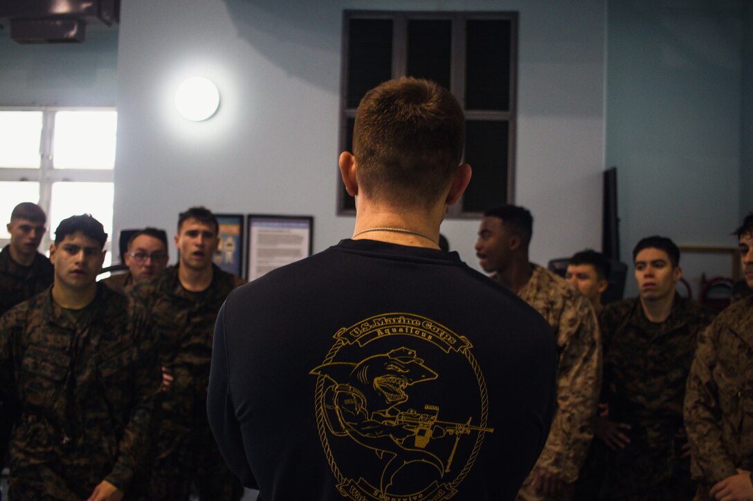 CATC Camp Fuji Marines catch a breath and receive guidance from their instructor during the Marine Corps Water Survival Program. (Courtesy Photo)
