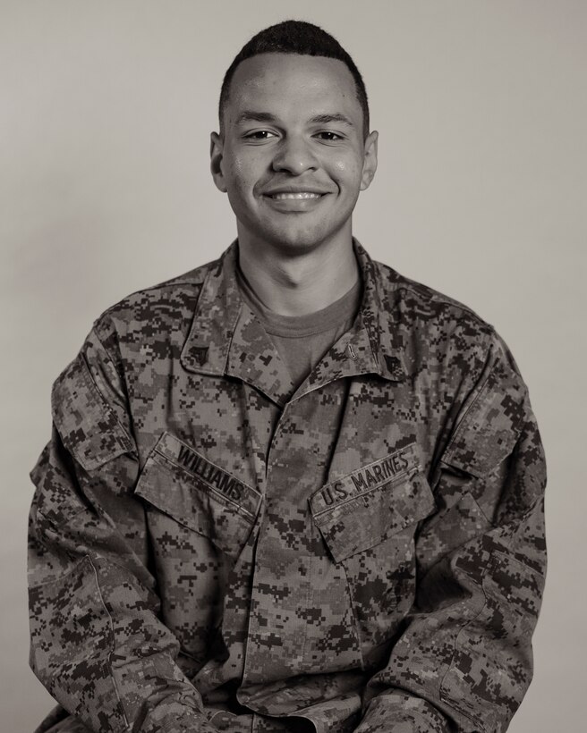U.S. Marine Corps Cpl. Eric Williams, a motor transport operator with 3rd Landing Support Battalion, 3rd Marine Logistics Group, poses for a studio portrait on Camp Foster, Okinawa, Japan, Feb. 22, 2023. From the ranks of private first class through sergeant, Marines shared their past journeys leading up to their current successes in the Marine Corps and goals they have for the future. (U.S. Marine Corps photo by Lance Cpl. Jonathan Beauchamp)