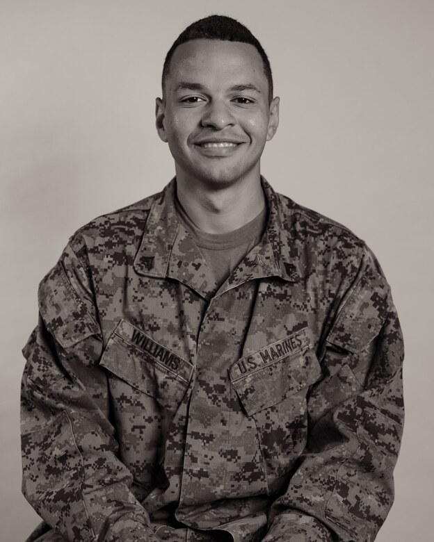 U.S. Marine Corps Cpl. Eric Williams, a motor transport operator with 3rd Landing Support Battalion, 3rd Marine Logistics Group, poses for a studio portrait during Black History Month on Camp Foster, Okinawa, Japan, Feb. 22, 2023. The month of February is designated as Black History Month to recognize the contributions and accomplishments of African Americans throughout American history. From the ranks of private first class through sergeant, Marines shared their past journeys leading up to their current successes in the Marine Corps and goals they have for the future. (U.S. Marine Corps photo by Lance Cpl. Jonathan Beauchamp)