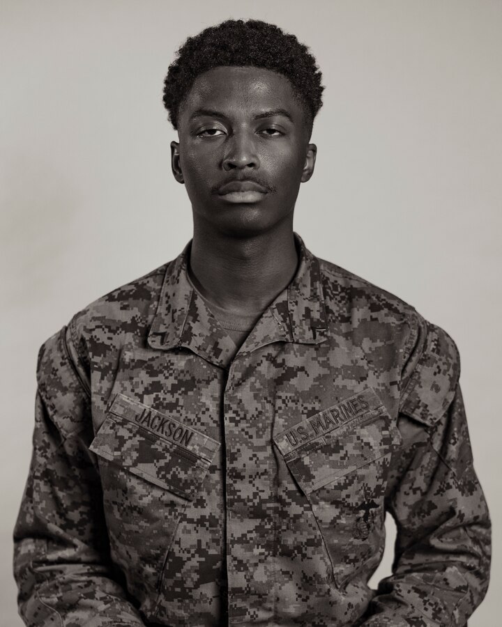 U.S. Marine Corps Pfc. Eugene Jackson, an administrative specialist with 3rd Network Battalion, Marine Corps Forces Cyberspace Command, poses for a studio portrait on Camp Foster, Okinawa, Japan, Feb. 22, 2023. From the ranks of private first class through sergeant, Marines shared their past journeys leading up to their current successes in the Marine Corps and goals they have for the future. (U.S. Marine Corps photo by Lance Cpl. Jonathan Beauchamp)