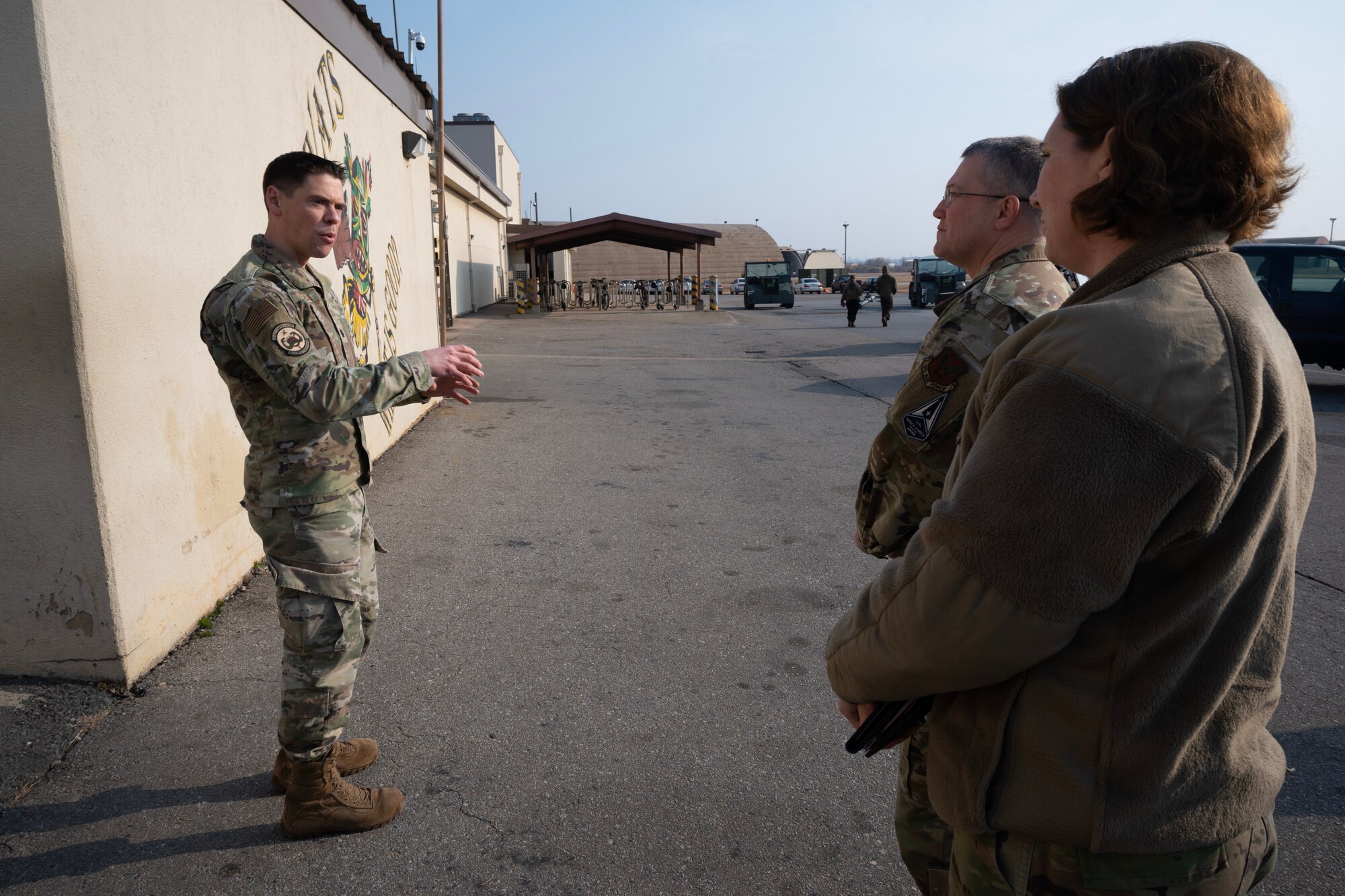 U.S. Air Force Lt. Col. Steven Massara (left), 80th Fighter Squadron commander, speaks to Ch. (Maj. Gen.) Randall Kitchens (mid), Department of the Air Force (DAF) chief of chaplains, and Chief Master Sgt. Sadie Chambers, DAF religious affairs senior enlisted advisor, at Kunsan Air Base, Republic of Korea, Feb. 23, 2023. As part of their battlefield circulation, Kitchens and Chambers interacted with Wolf Pack Airmen across the installation. (U.S. Air Force photo by Senior Airman Akeem K. Campbell)