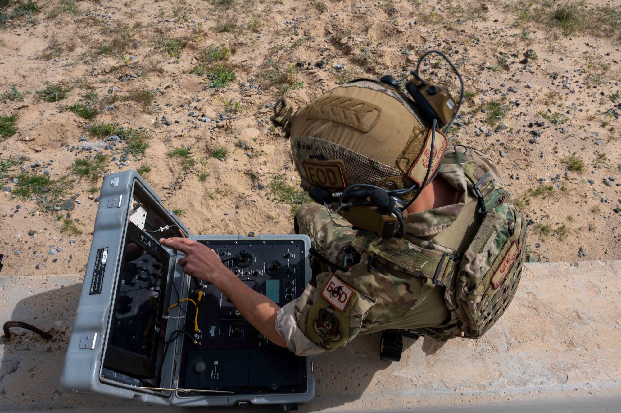 U.S. Air Force Senior Airman Skylar Ackley, a 386th Expeditionary Civil Engineering Squadron explosive ordnance disposal technician, assists in eliminating the simulated threat of a mock downed Unmanned Aircraft System during a UAS response exercise at Ali Al Salem Air Base, Kuwait, Feb. 21, 2023.