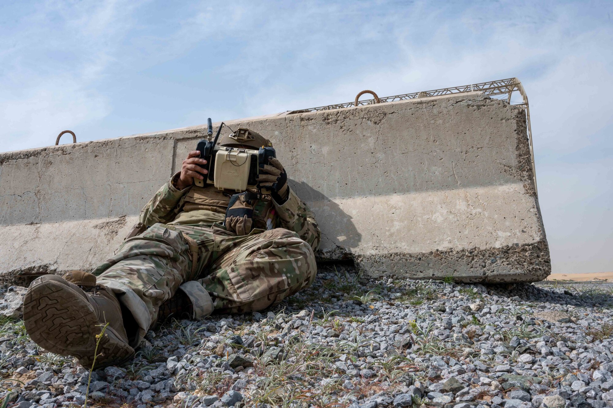 U.S. Air Force Staff Sgt. Ismael Del Toro, a 386th Expeditionary Civil Engineering Squadron explosive ordnance disposal technician, operates a MTGR® robot during an Unmanned Aircraft Systems response exercise at Ali Al Salem Air Base, Kuwait, Feb. 21, 2023.