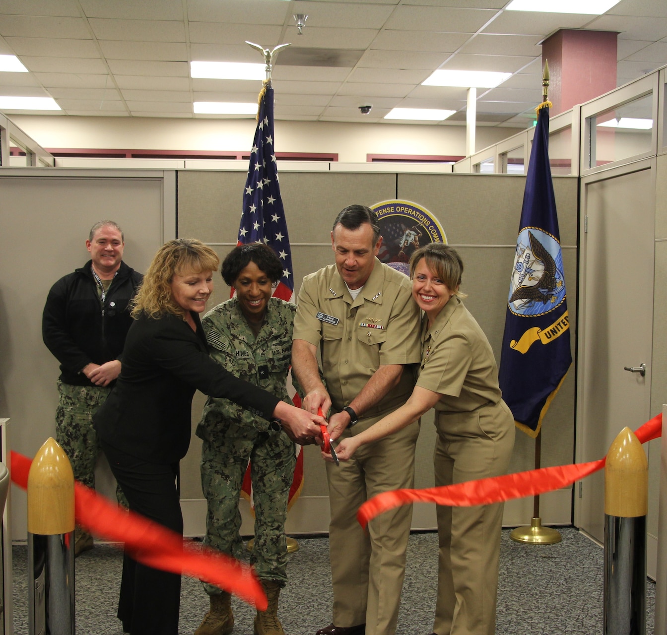 From left, Ms. Tami North, Director of Information Warfare Readiness, Naval Information Forces; Rear Adm. Tracy Hines, Navy Cyber Security Division Director, Office of the Chief of Naval Operations; Vice Adm. Craig Clapperton, Commander, Fleet Cyber Command / Commander, 10th Fleet; and
Capt. Christina Hicks, Commanding Officer, Navy Cyber Defense Operations Command, pose for a photo to celebrate the opening of Navy Cyber Defense Operations Command West in San Diego, Calif., Feb. 16, 2023 (Photo by: IT2 Oscar Alejandro).