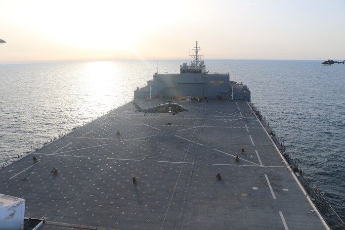 ARABIAN GULF (Feb. 22, 2023) A United Arab Emirates Armed Forces UH-60M Black Hawk hovers above the flight deck of expeditionary sea base USS Lewis B. Puller (ESB 3) during deck landing qualifications in the Arabian Gulf, Feb. 22, 2023. Puller is deployed to the U.S. 5th Fleet area of operations to help ensure maritime security and stability in the Middle East region