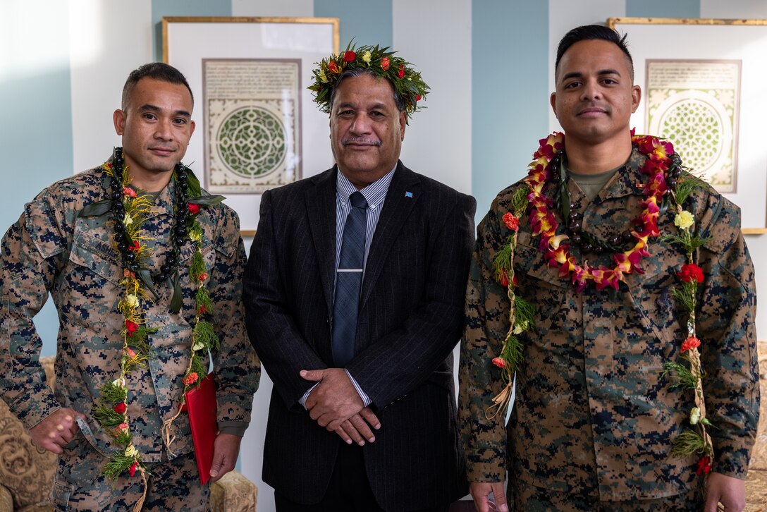 U.S. Marine Corps Warrant Officer Steve Asher, a utilities officer with 1st Combat Engineer Battalion, 1st Marine Division, left, Akillino Harris Susaia, the ambassador of Micronesia, center, and Warrant Officer Jerry Tolenoa, a Marine Corps Community Services officer with Marine Corps Base Hawaii Kaneohe Bay, right, pose for a group photo after their pinning ceremony to warrant officer on Marine Corps Base Quantico, Virginia, Feb. 1, 2023. The Ambassador of the Federated States of Micronesia to the United States, family and friends attended the promotion ceremony of Asher and Tolenoa who joined the Marine Corps from the Federated States of Micronesia. (U.S. Marine Corps photo by Lance Cpl. Joaquin Dela Torre)