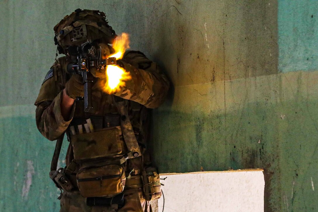 A soldier fires a weapon during a training exercise.