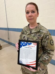 Sgt. 1st Class Tiffany Alligood is the readiness noncommissioned officer and a combat medic with the Kansas Army National Guard’s 1077th Ground Ambulance Company at the Lenexa armory.