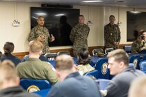 U.S. Marine Corps Lt. Gen. Brian W. Cavanaugh, right, the commanding general of Fleet Marine Force, Atlantic, Marine Forces Command, Marine Forces Northern Command, speaks with Naval officers and Chiefs stationed aboard the USS Bataan (LHD 5), left, during a ship tour on Naval Station Norfolk, Virginia, Feb. 24, 2023. Cavanaugh toured the ship to discuss readiness and capabilities with leadership, as well as meet and converse with Marines and Sailors. The Bataan, or "Big Five," is a Wasp-class amphibious assault ship, which, along with the San Antonio class amphibious transport dock ship USS Mesa Verde (LPD 19), and Harpers Ferry class dock landing ship USS Carter Hall (LSD 50), forms the Bataan Amphibious Ready Group. (U.S. Marine Corps photo by Casey Price)