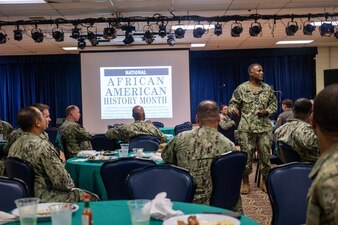 Capt. Gregory D. Blyden delivers remarks during an African American History Month observance at Diego Garcia.