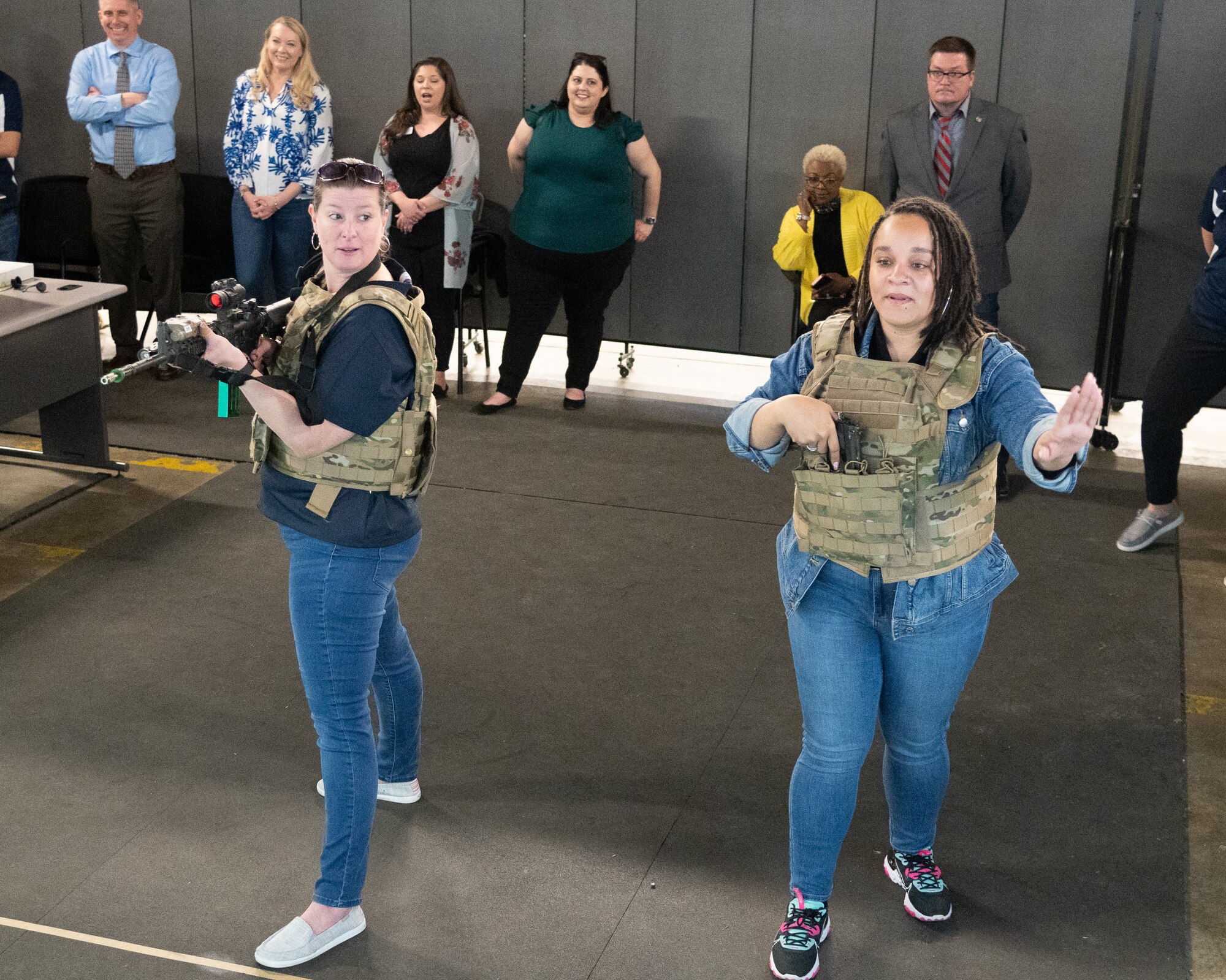 Lynsey Baer and Precious Benson, both 436th Airlift Wing honorary commanders, participate in a Multiple Interactive Learning Objectives (MILO) Range during an immersion tour on Dover Air Force Base, Delaware, Feb. 23, 2023. Honorary commanders toured the base and met with Airmen from various squadrons to familiarize themselves with the Team Dover mission. (U.S. Air Force photo by Mauricio Campino)