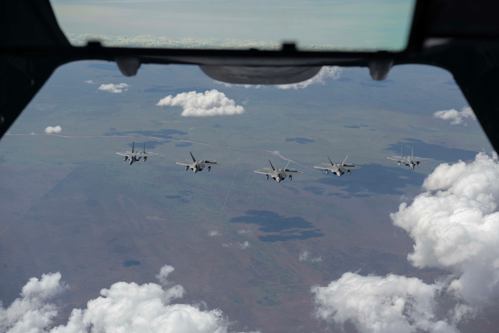 fighter jets fly in formation