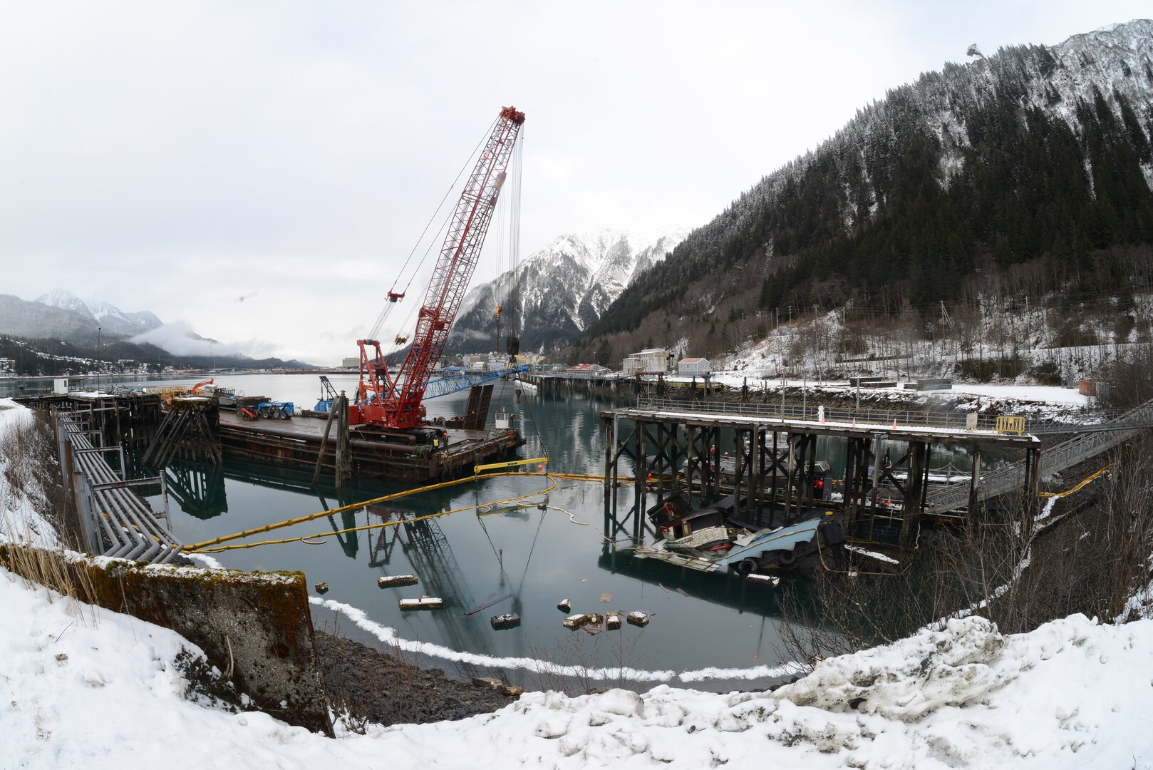 The Tagish, a 107-foot tugboat, built during World War II, is submerged at the Gastineau Channel dock in Juneau, Alaska, Feb. 9, 2023