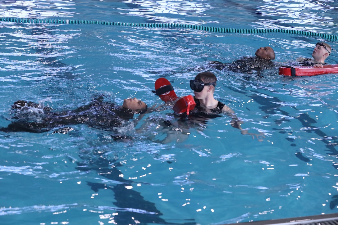 Recruits from Kilo Company, 3rd Recruit Training Battalion, conduct swim qualification remediation on Marine Corps Recruit Depot Parris Island, S.C., Dec. 15, 2021. Recruits who fail their initial swim qualification are required to return for additional training. (U.S. Marine Corps photo by Lance Cpl. Colin Harper)