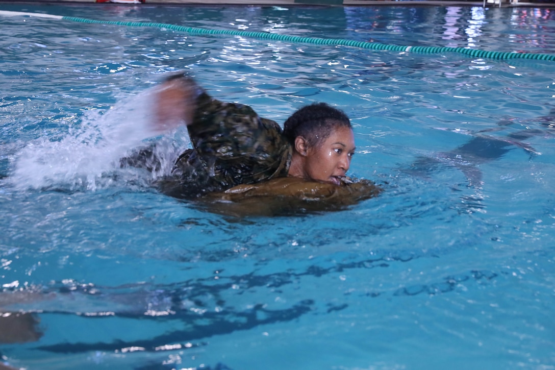 Recruits from Kilo Company, 3rd Recruit Training Battalion, conduct swim qualification remediation on Marine Corps Recruit Depot Parris Island, S.C., Dec. 15, 2021. Recruits who fail their initial swim qualification are required to return for additional training. (U.S. Marine Corps photo by Lance Cpl. Colin Harper)