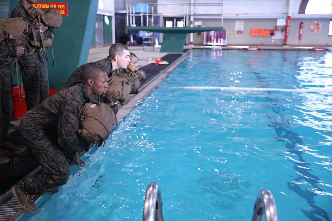 Recruits from Kilo Company, 3rd Recruit Training Battalion, conduct swim qualification remediation on Marine Corps Recruit Depot Parris Island, S.C., Dec. 15, 2021. Recruits who fail their initial swim qualification are required to return for additional training. (U.S. Marine Corps photo by Lance Cpl. Colin Harper)