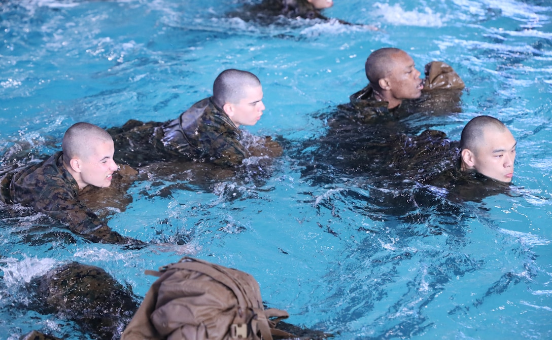 Recruits from Kilo Company, 3rd Recruit Training Battalion, conduct swim qualification remediation on Marine Corps Recruit Depot Parris Island, S.C., Dec. 15, 2021. Recruits who fail their initial swim qualification are required to return for additional training. (U.S. Marine Corps photo by Lance Cpl. Colin Harper)
