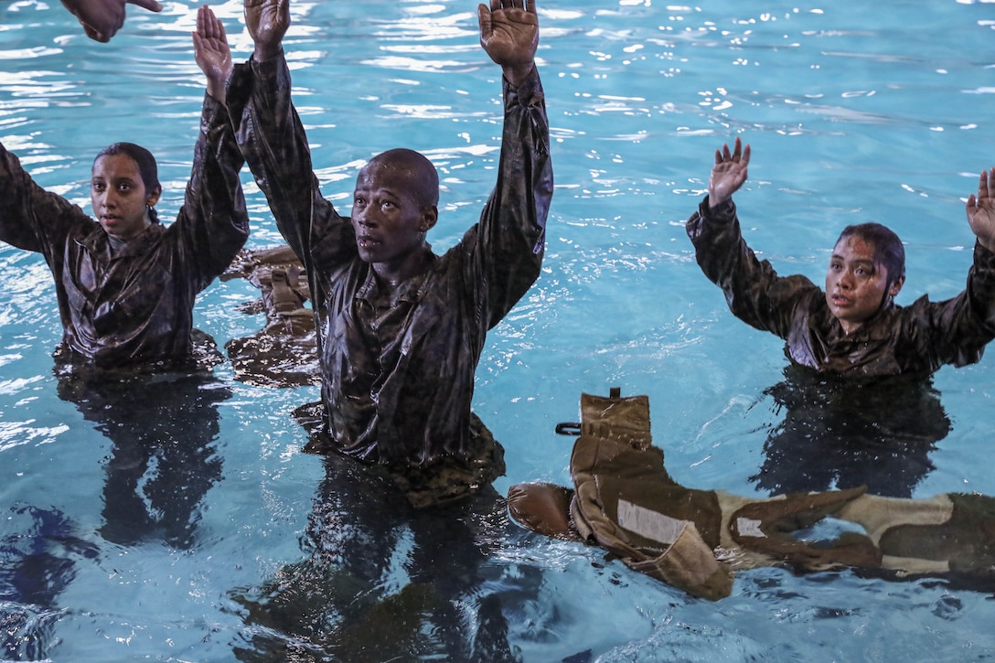 Recruits from Kilo Company, 3rd Recruit Training Battalion, conduct swim qualification remediation on Marine Corps Recruit Depot Parris Island, S.C., Dec. 15, 2021. Recruits who fail their initial swim qualification are required to return for additional training. (U.S. Marine Corps photo by Lance Cpl. Colin Harper)